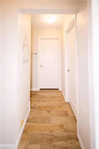 Hall featuring light hardwood / wood-style flooring