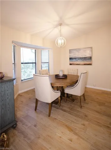 Dining room featuring a chandelier and hardwood / wood-style floors