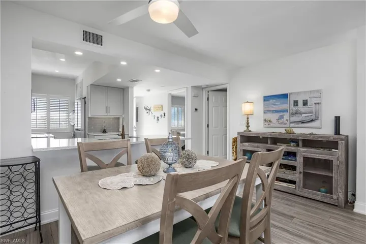 Dining space featuring light wood-style flooring, recessed lighting, and a ceiling fan