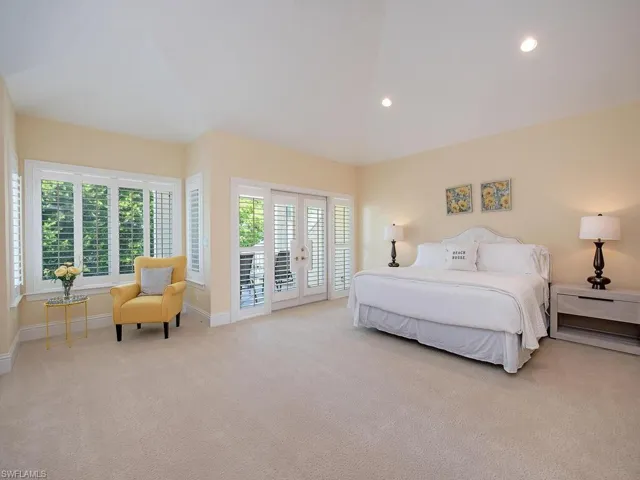 Carpeted bedroom featuring access to outside, recessed lighting, and french doors