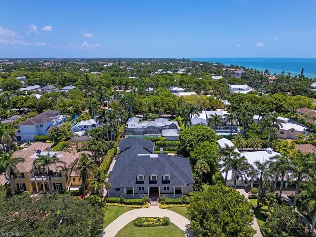 Aerial perspective of suburban area with a large body of water