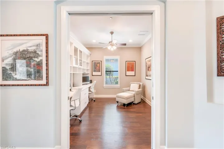 Living area featuring ceiling fan, wood finished floors, crown molding, baseboards, and recessed lighting