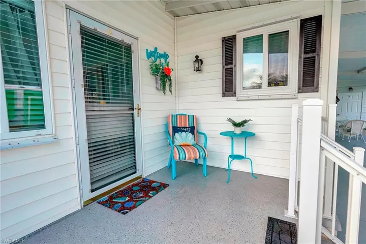 Doorway to property with covered porch