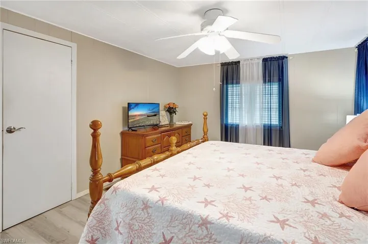 Bedroom featuring light wood-type flooring and ceiling fan