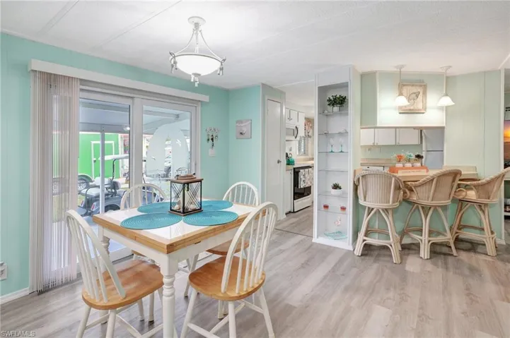 Dining area with light hardwood / wood-style floors