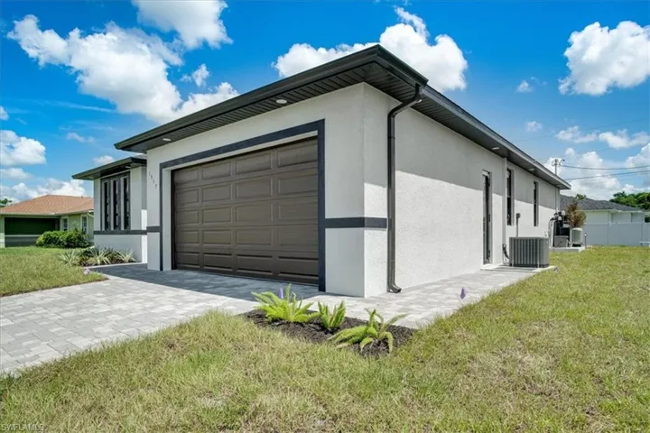 Garage with a lawn