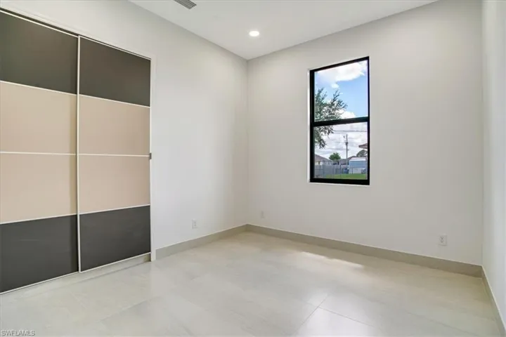 Guess 2 room with light tile patterned flooring