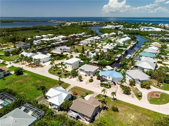 Aerial view of residential area with a nearby body of water