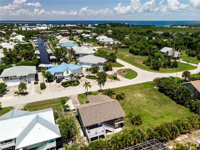 Aerial view of residential area with a large body of water
