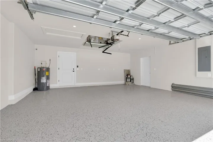 Garage with electric panel and water heater