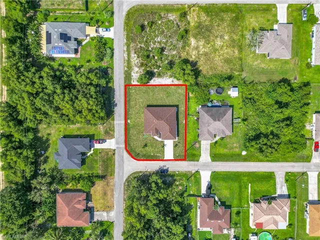 Aerial perspective of suburban area with property parcel outlined