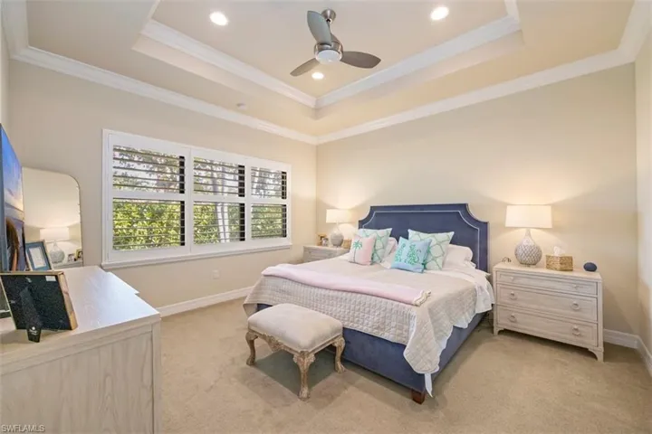 Bedroom featuring ceiling fan, ornamental molding, light carpet, and recessed lighting