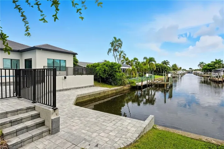 Dock with a water view and a patio