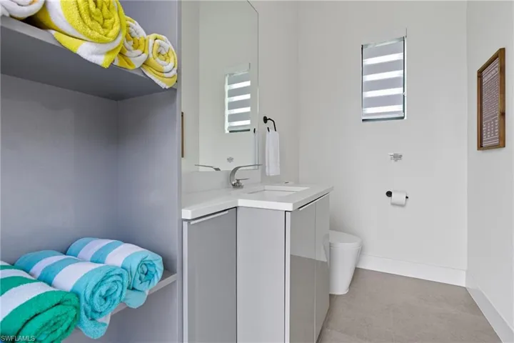 Bathroom with vanity and baseboards