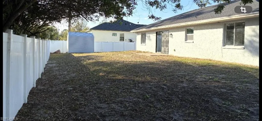 View of fenced backyard