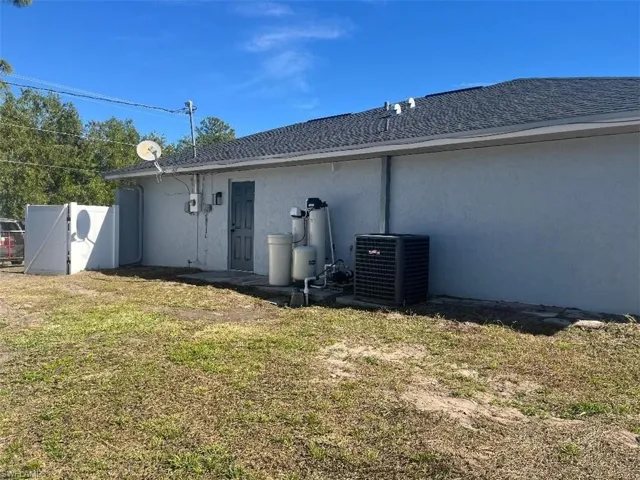 Back of house with stucco siding