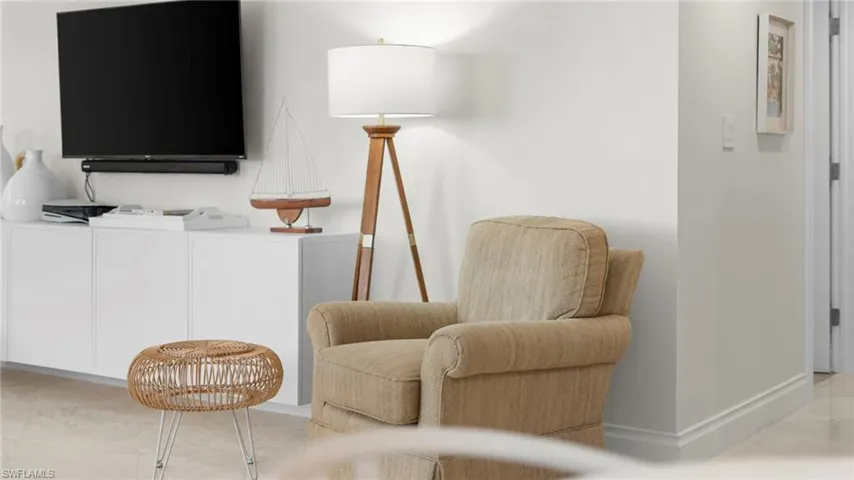 Sitting room featuring washing machine and dryer
