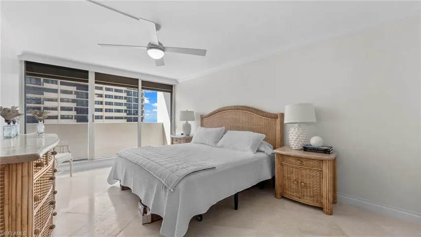 Bedroom featuring floor to ceiling windows, ceiling fan, and crown molding