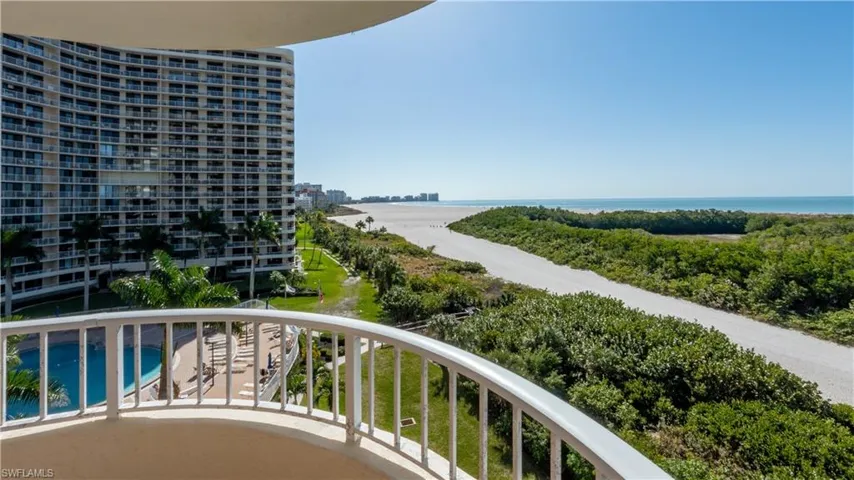 Balcony featuring view of pool and a water view