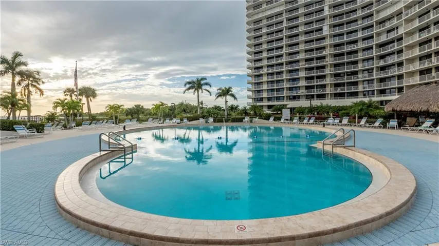 Community pool with a patio