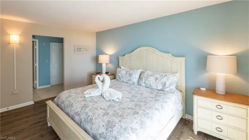 Bedroom featuring baseboards and wood finished floors