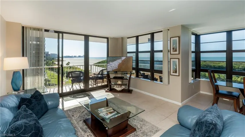 Living area with tile patterned flooring and healthy amount of natural light
