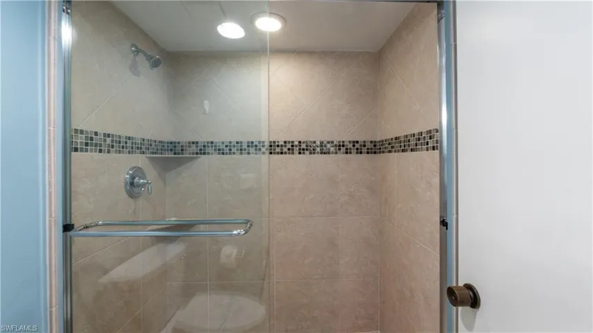 Bathroom featuring a shower stall