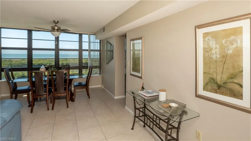 Dining area featuring ceiling fan and light tile patterned floors