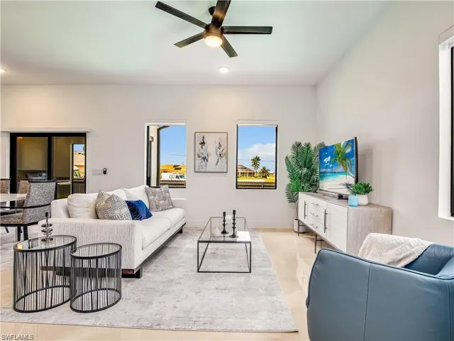 Living area featuring ceiling fan and recessed lighting (Model Home)