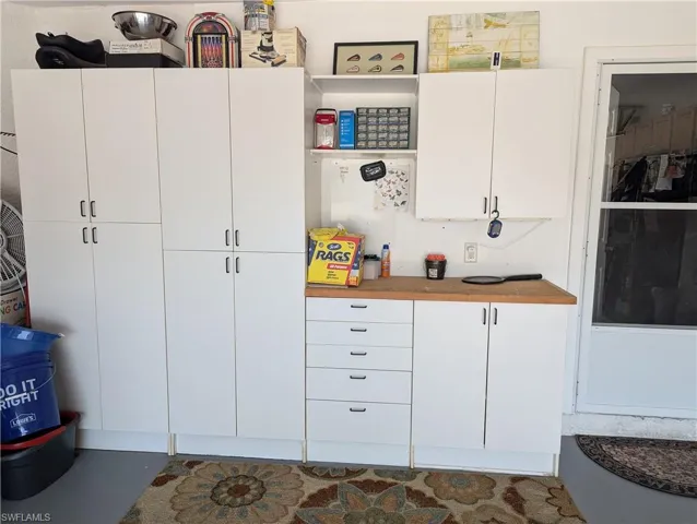 Kitchen with white cabinets and open shelves