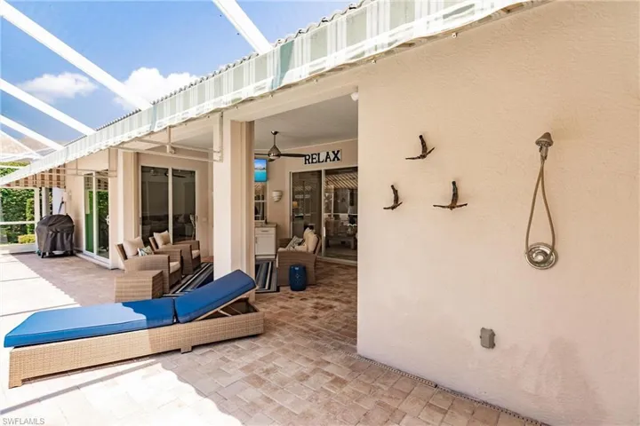 View of patio / terrace with area for grilling and ceiling fan