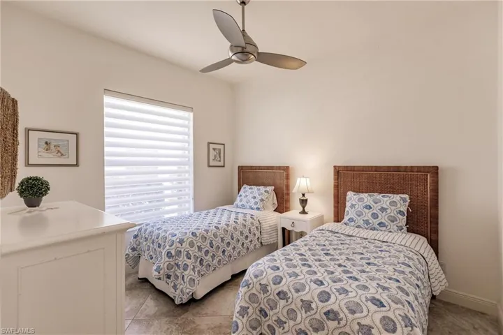 Bedroom featuring tile floors and ceiling fan