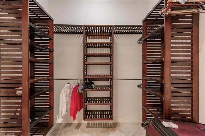 Walk in closet featuring tile floors
