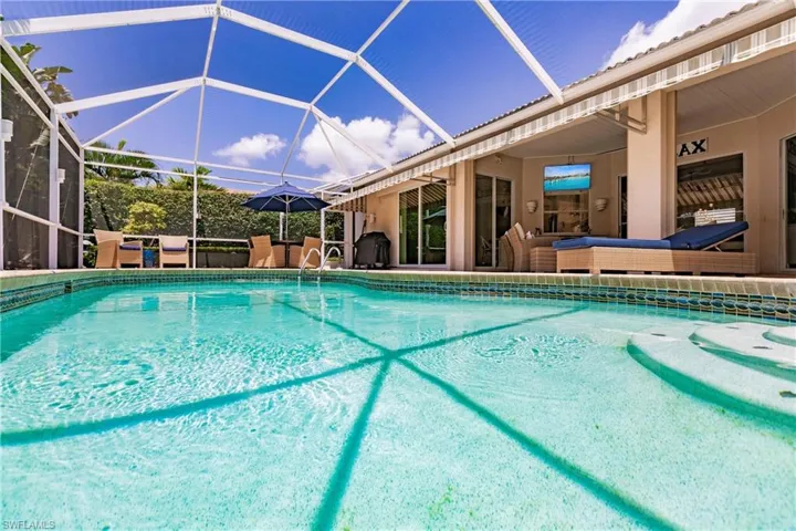 View of pool with a lanai