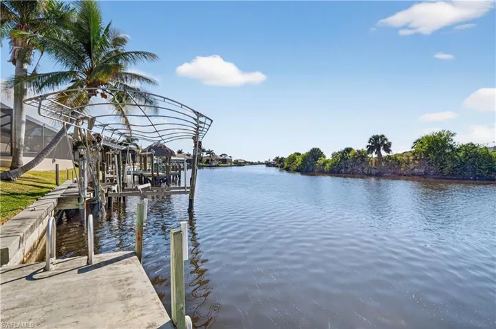 Dock with a water view and boat lift