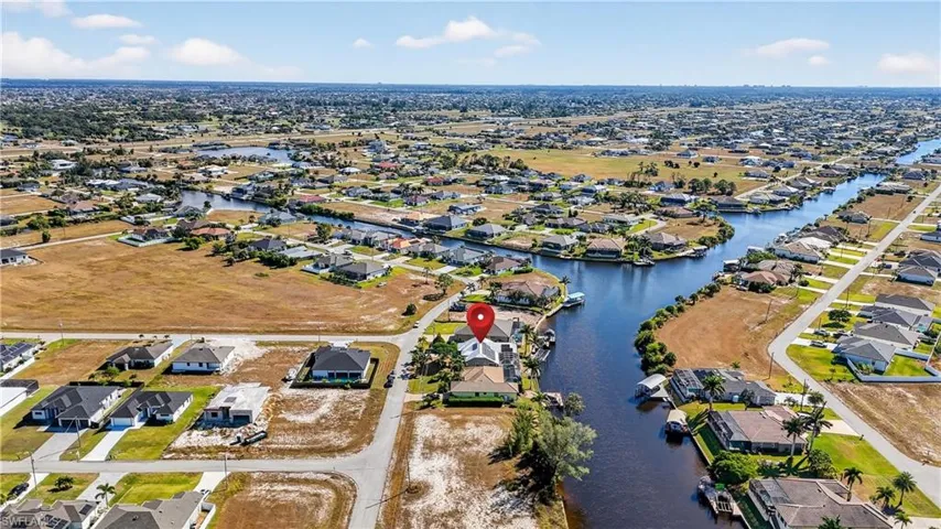 Aerial view of residential area featuring canals