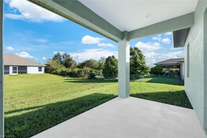 Fenced backyard with a patio area