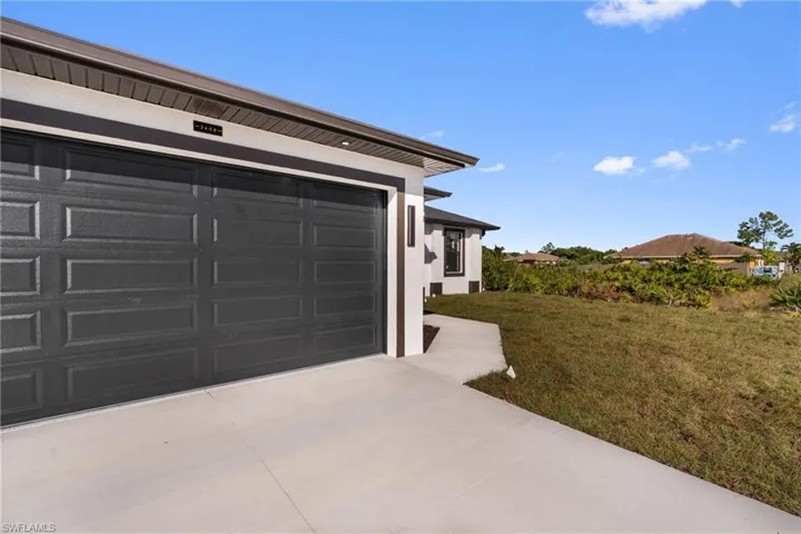 Garage featuring driveway