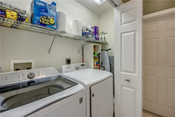 Laundry closet in Kitchen.  Washer is 2022.
