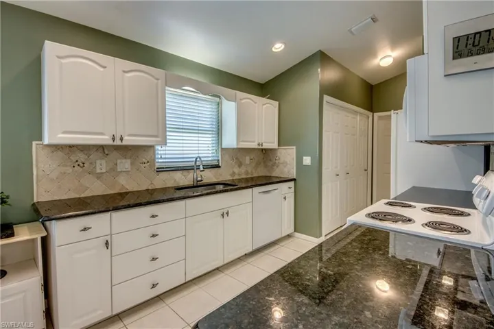 Sink wall with Bosch dishwasher.