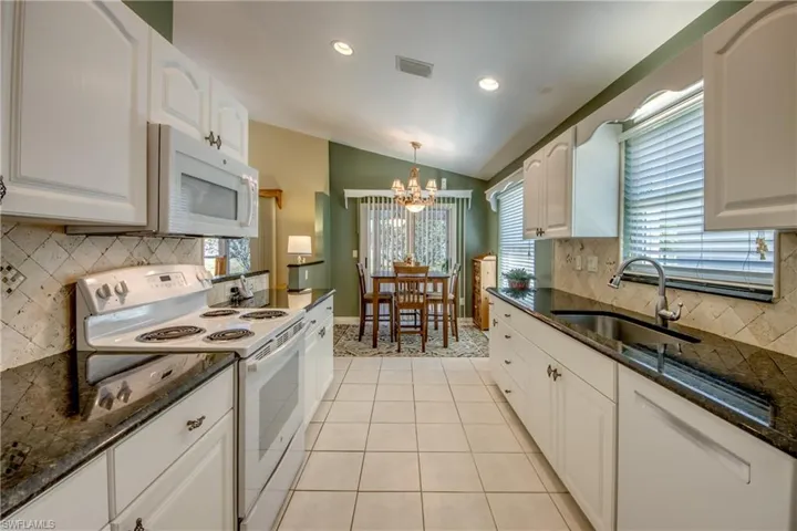 Looking to kitchen nook from garage entry.