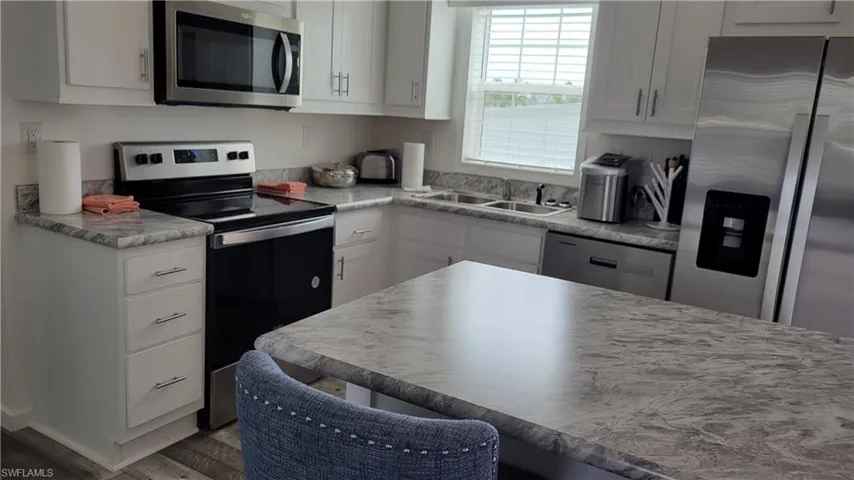 View of kitchen over island