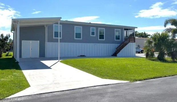 SW side of home featuring double doors to attached shed