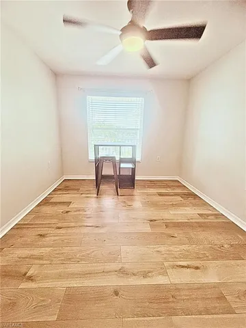 Unfurnished room featuring light wood finished floors and ceiling fan