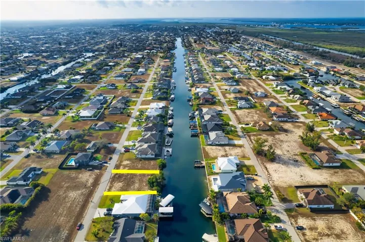 View of property location with nearby suburban area and a large body of water