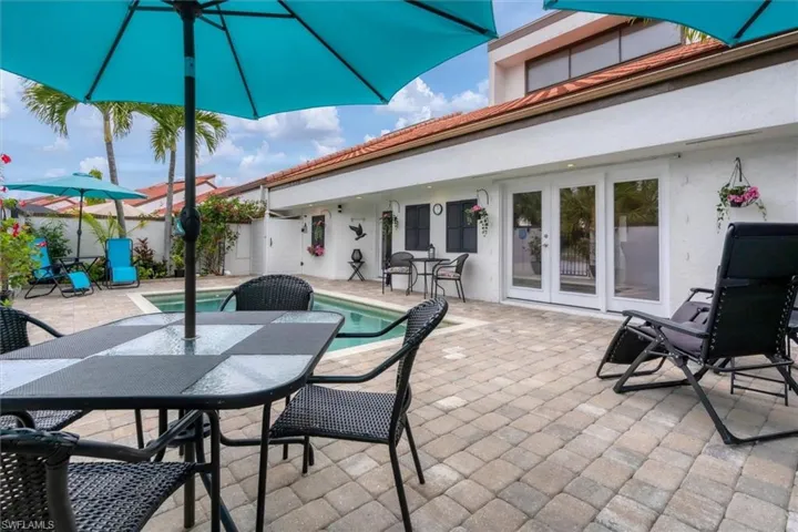 View of patio / terrace with a fenced in pool and french doors