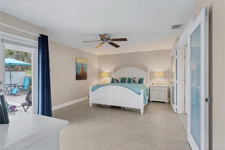 Bedroom featuring french door out to courtyard and pool