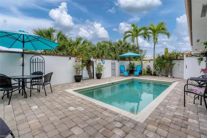 View of swimming pool with a patio area