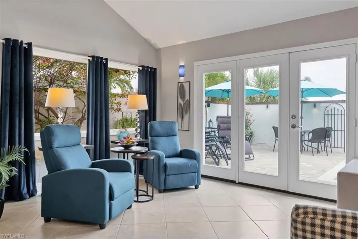 French doors out to courtyard and pool from living area