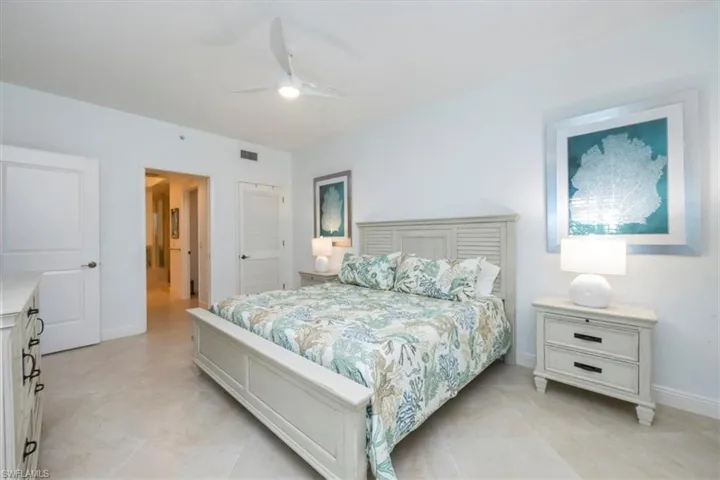 Bedroom featuring ceiling fan and a closet